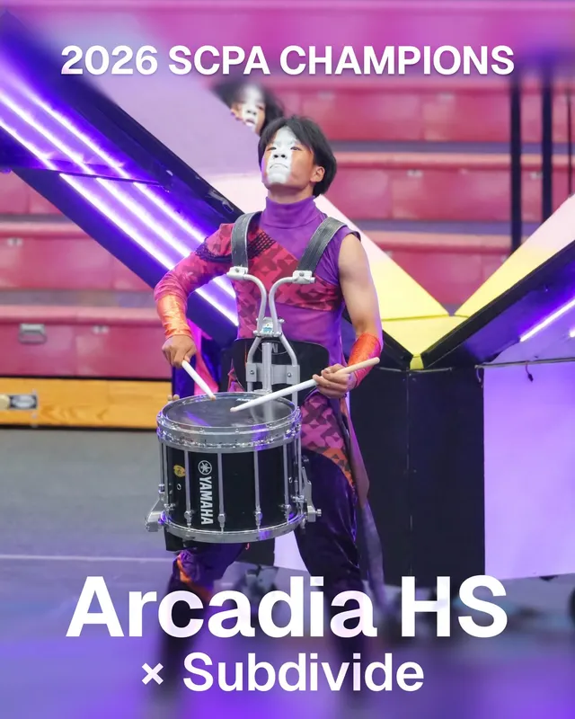 An Arcadia HS snare drummer mid-performance, captioned 2026 SCPA Champions, Arcadia HS × Subdivide